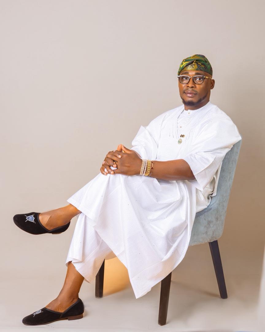 Omoba Kasali Adeboye Yusuf seated in white agbada